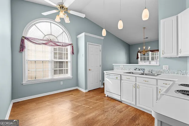 a view of a kitchen with marble kitchen and windows