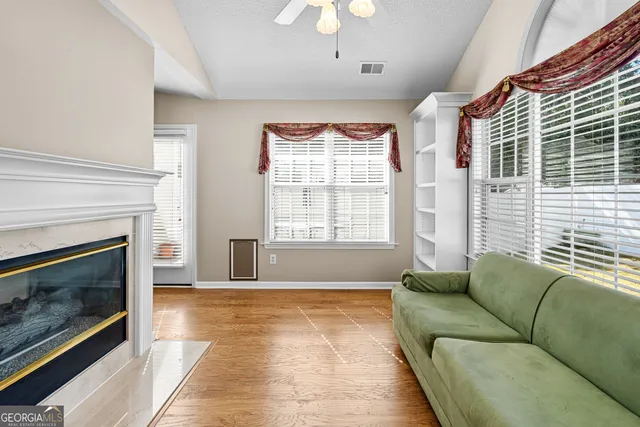 a living room with furniture and a fireplace