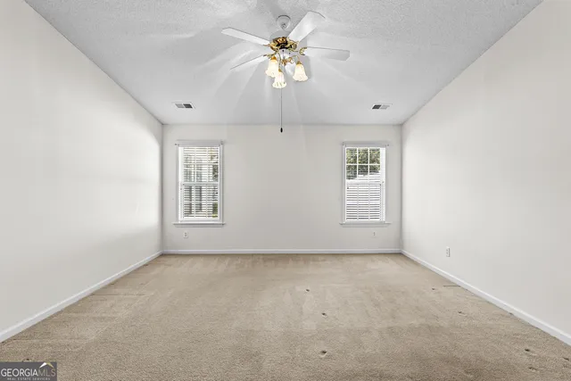 an empty room with a bathroom