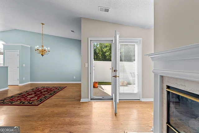 a view of backyard with a table and chairs