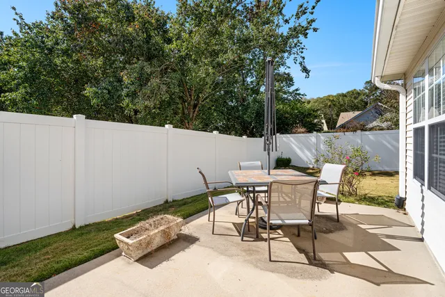 a view of a house with pool and yard