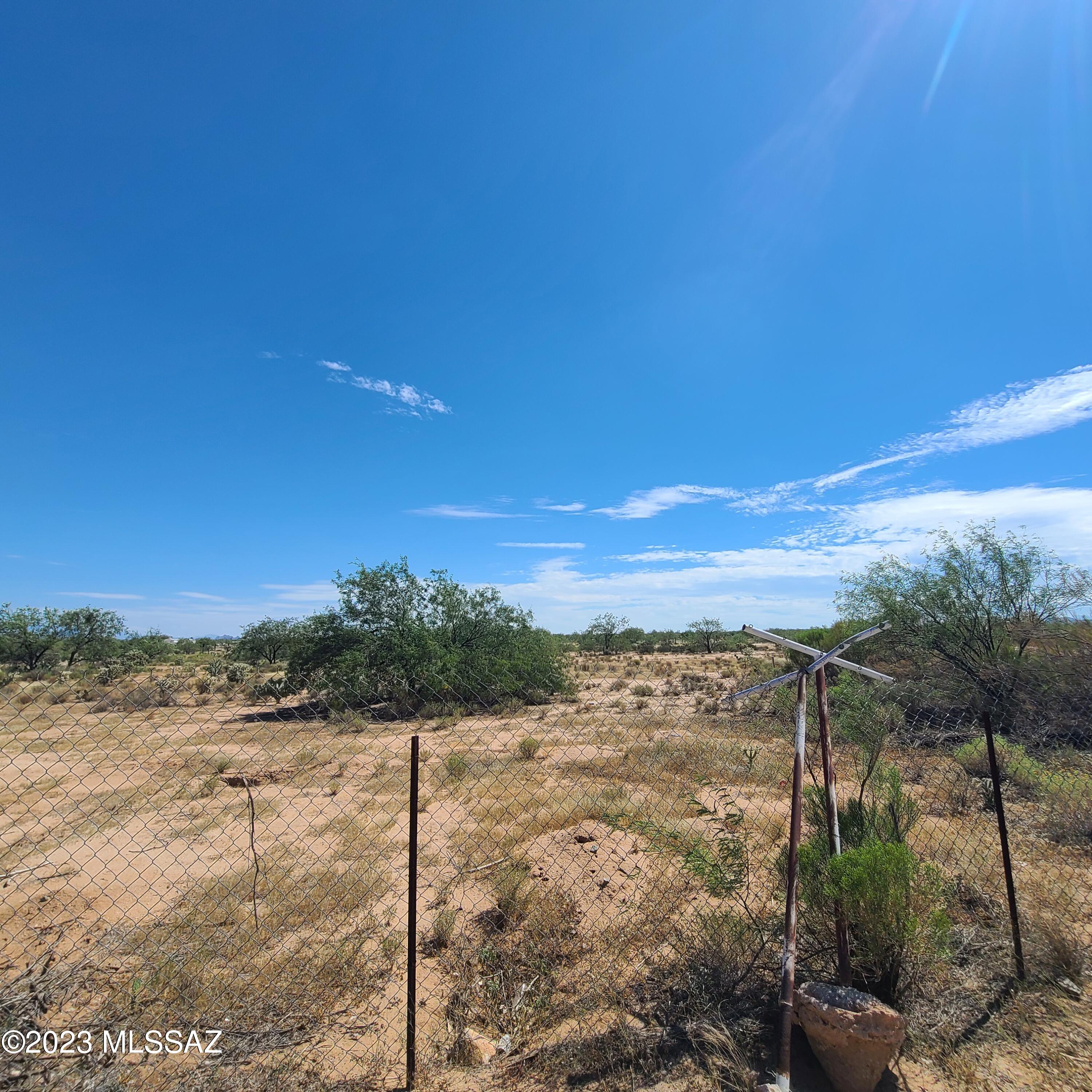 8896 South Marstellar Road Tucson, AZ 85736 - Photo 33 of 39 a view of a yard with wooden fence
