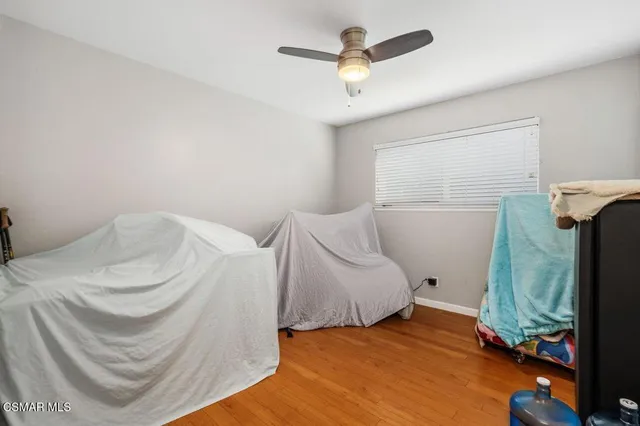 a bedroom with a bed and a mirror