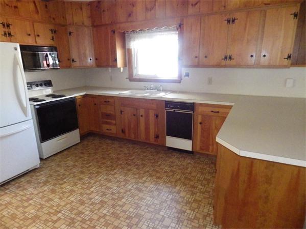 39 South Row Road Lunenburg, MA 01462 - Photo 7 of 30 a kitchen with stainless steel appliances granite countertop a stove a sink and a microwave