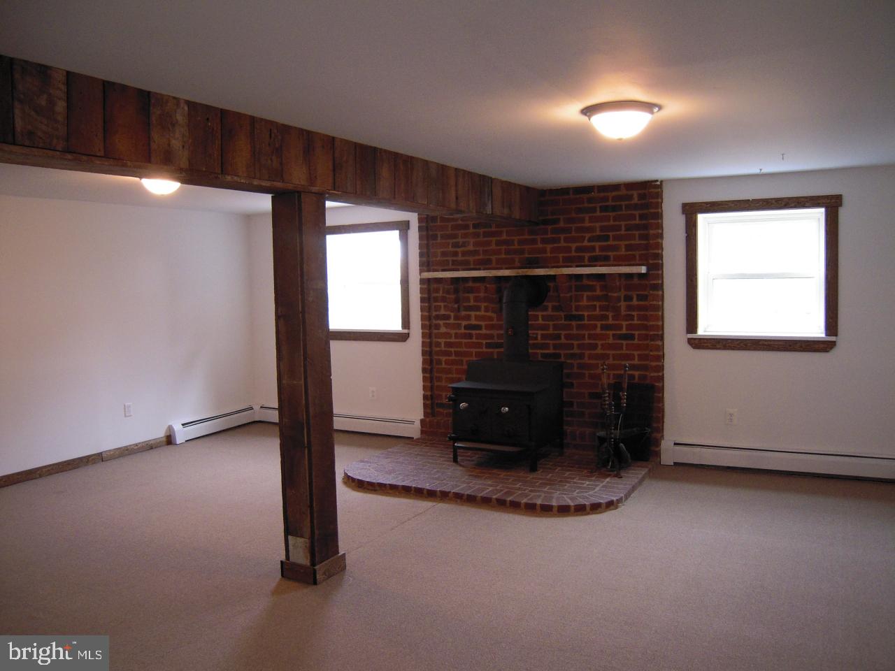 265 Rock Point Road Marietta, PA 17547 - Photo 10 of 13 Lower level family room with coal stove
