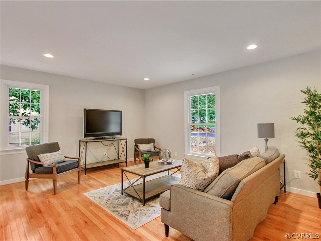 11921 Murray Hill Road Midlothian, VA 23113 - Photo 12 of 34 a living room with furniture and a flat screen tv