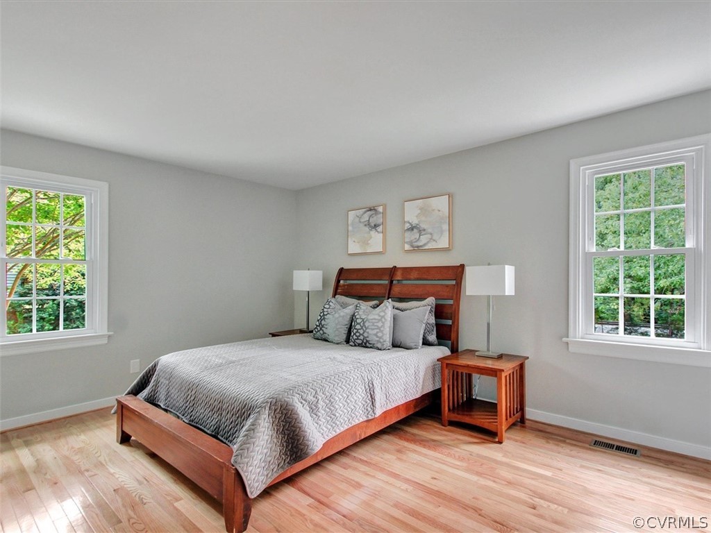 11921 Murray Hill Road Midlothian, VA 23113 - Photo 19 of 34 a bedroom with a bed and windows
