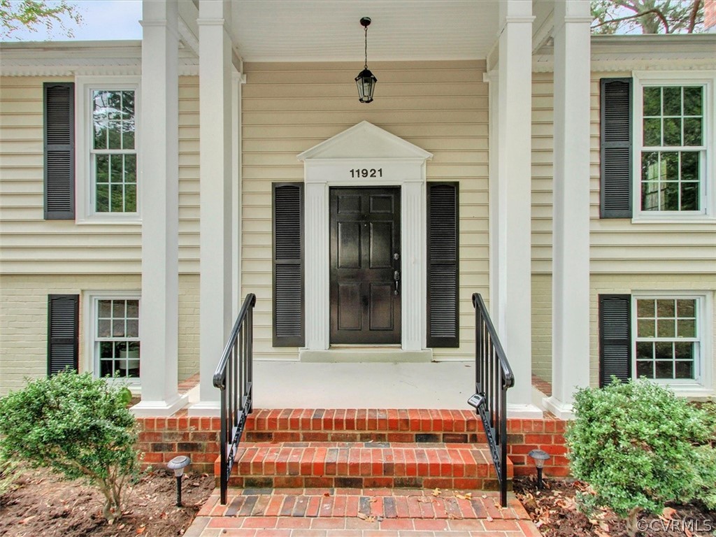 11921 Murray Hill Road Midlothian, VA 23113 - Photo 2 of 34 a front view of a house with a yard