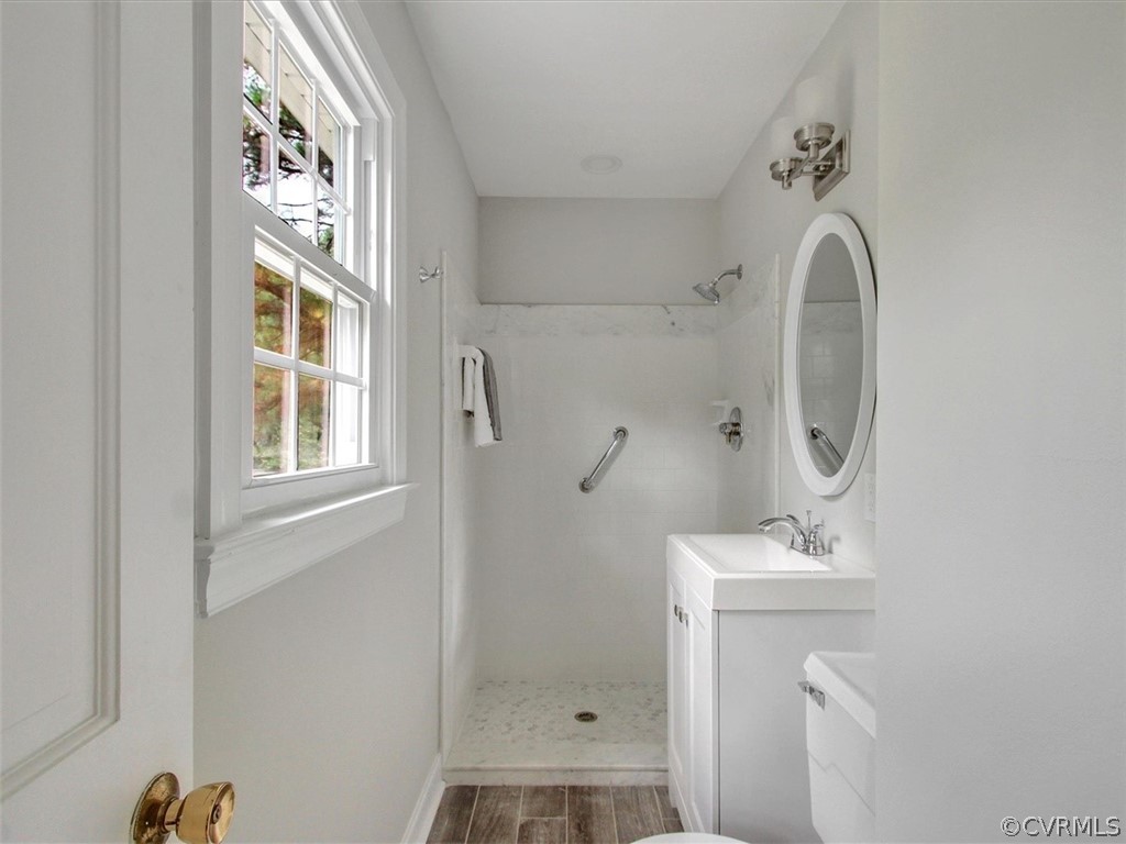 11921 Murray Hill Road Midlothian, VA 23113 - Photo 21 of 34 a bathroom with a sink a toilet and shower