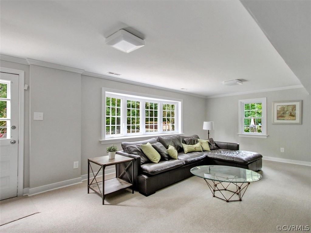11921 Murray Hill Road Midlothian, VA 23113 - Photo 23 of 34 a living room with furniture and a window