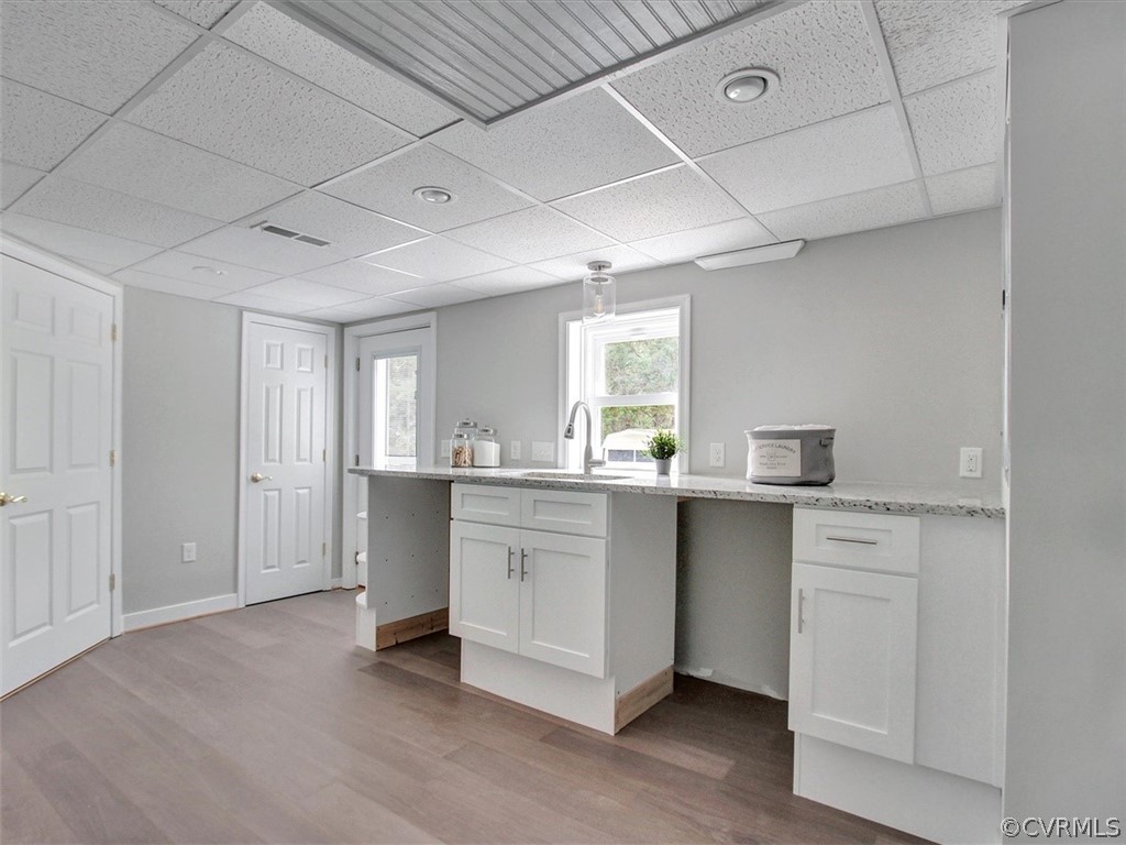 11921 Murray Hill Road Midlothian, VA 23113 - Photo 29 of 34 a kitchen with white cabinets and sink