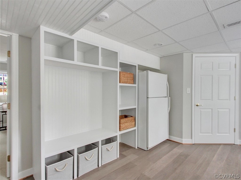 11921 Murray Hill Road Midlothian, VA 23113 - Photo 30 of 34 a view of an empty room with wooden floor and cabinet