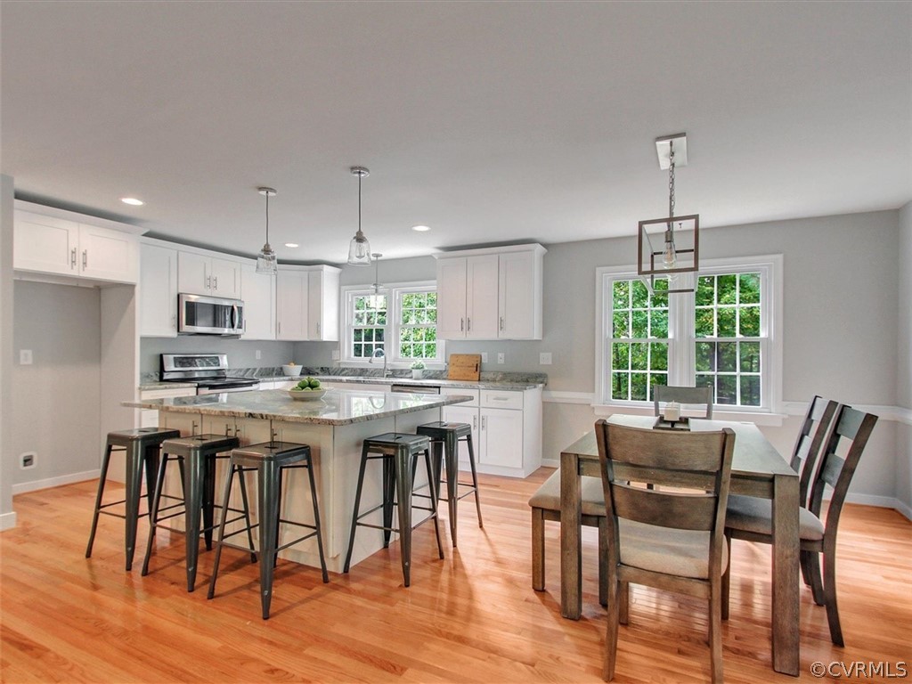 11921 Murray Hill Road Midlothian, VA 23113 - Photo 3 of 34 a view of a dining room with furniture window and wooden floor