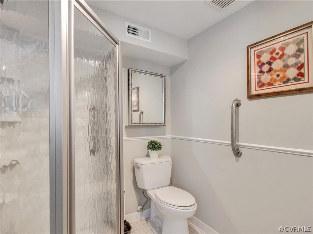 11921 Murray Hill Road Midlothian, VA 23113 - Photo 31 of 34 a bathroom with a toilet and a shower
