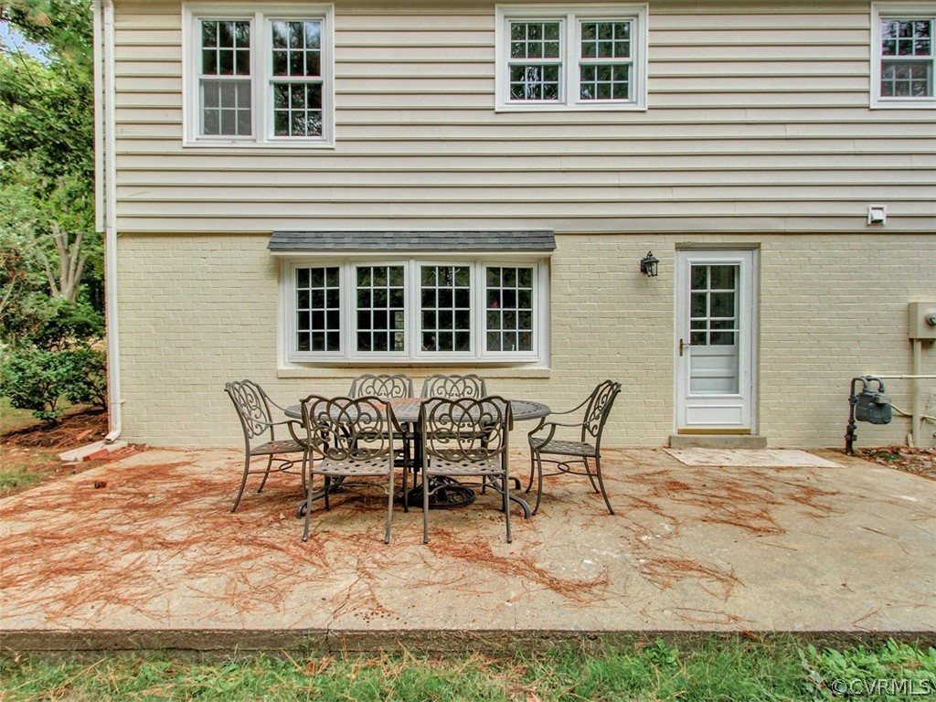 11921 Murray Hill Road Midlothian, VA 23113 - Photo 32 of 34 a view of a house with backyard and sitting area