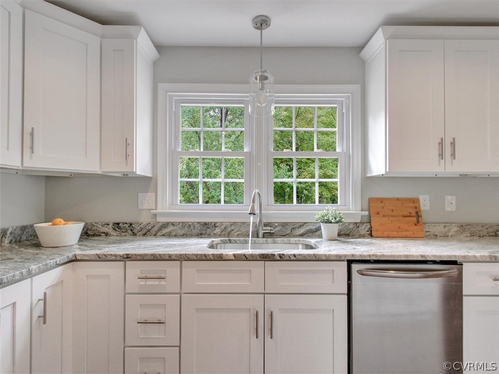 11921 Murray Hill Road Midlothian, VA 23113 - Photo 4 of 34 a kitchen with granite countertop a sink window and cabinets