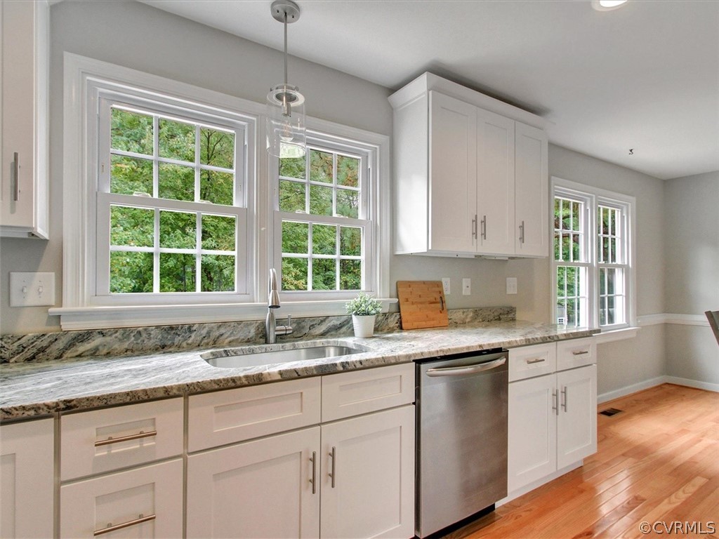11921 Murray Hill Road Midlothian, VA 23113 - Photo 7 of 34 a kitchen with granite countertop white cabinets window and a sink