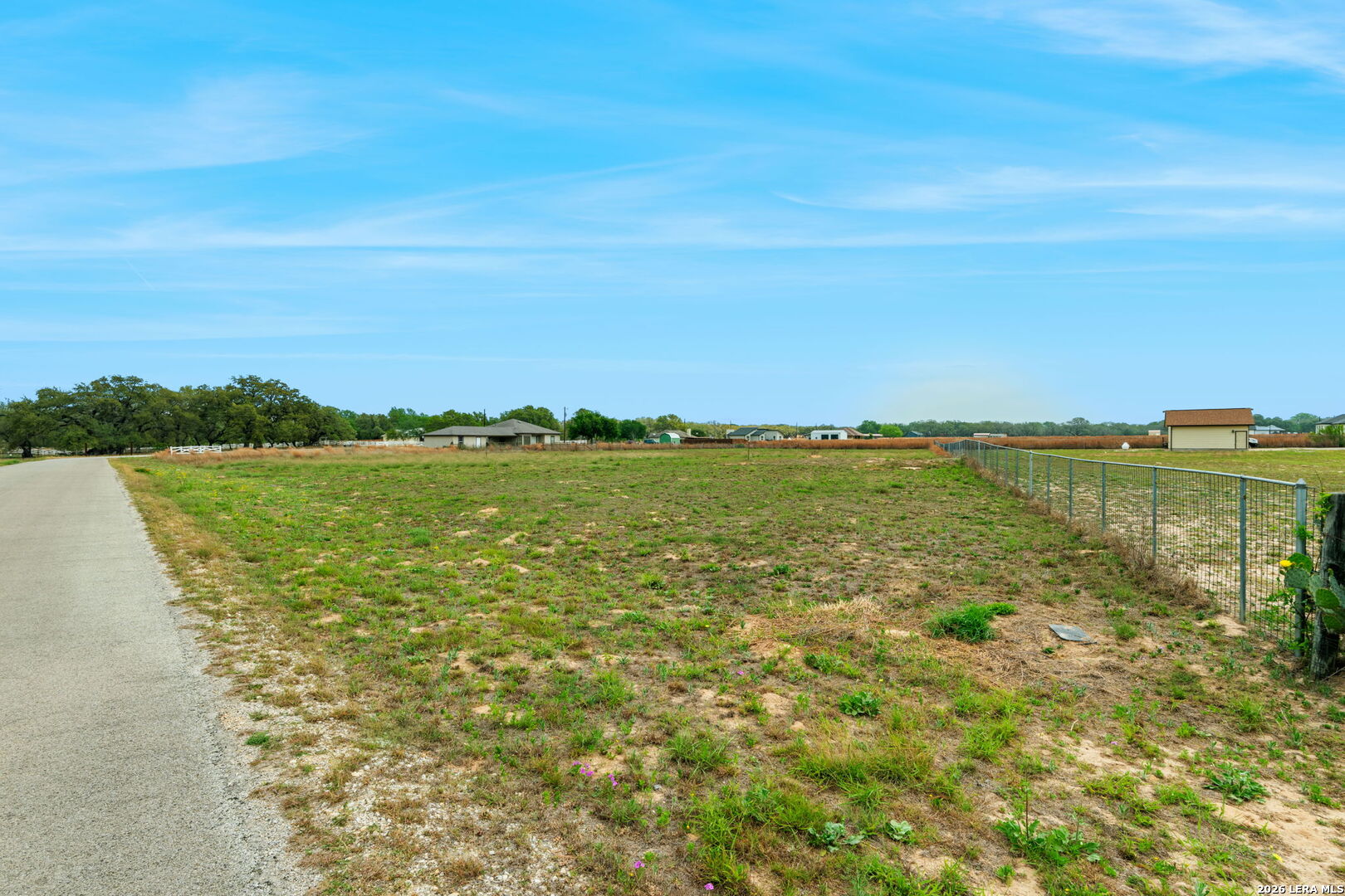 215 Mustang Ridge Natalia, TX 78059 - Photo 12 of 17 a view of a lake with a city