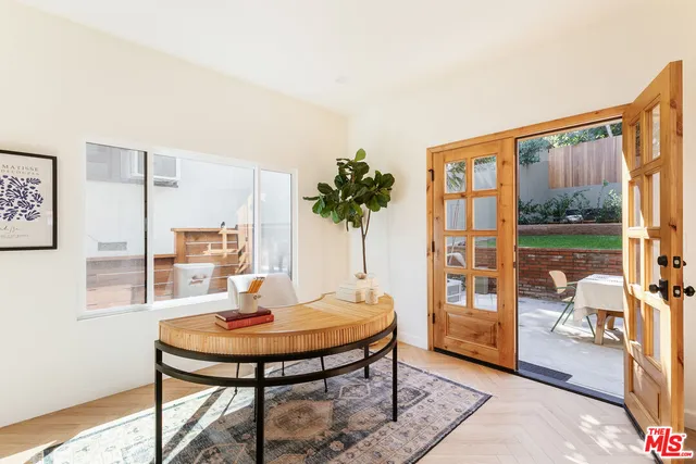 a living room with furniture and a table