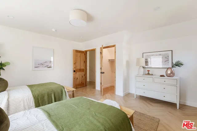 a bedroom with furniture and window