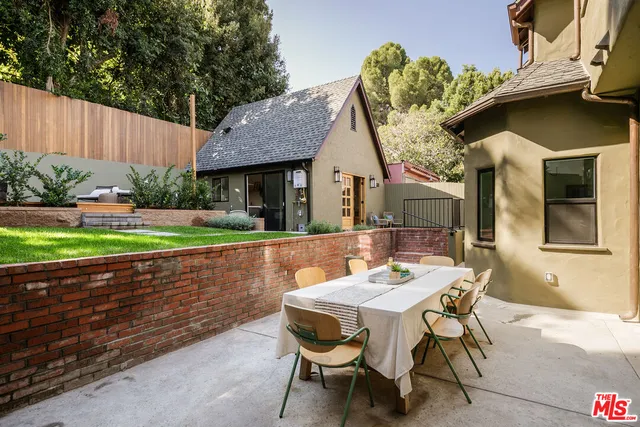 a patio with table and chairs