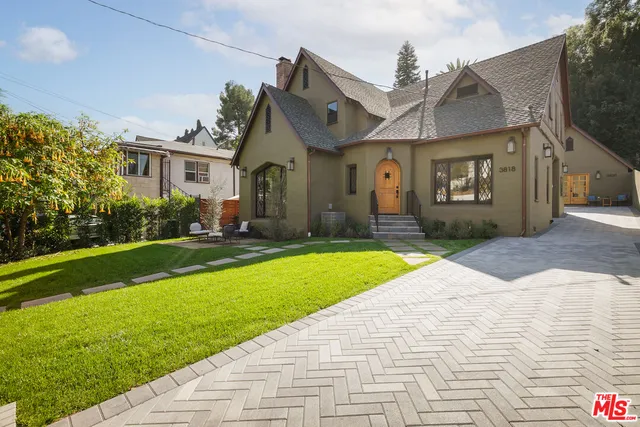 a front view of a house with garden
