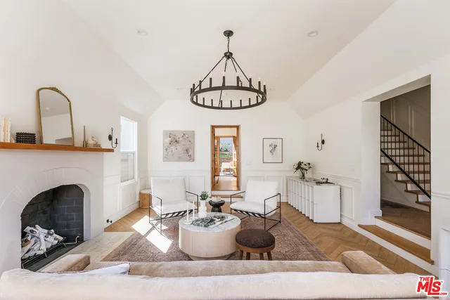 a living room with furniture a window and fireplace