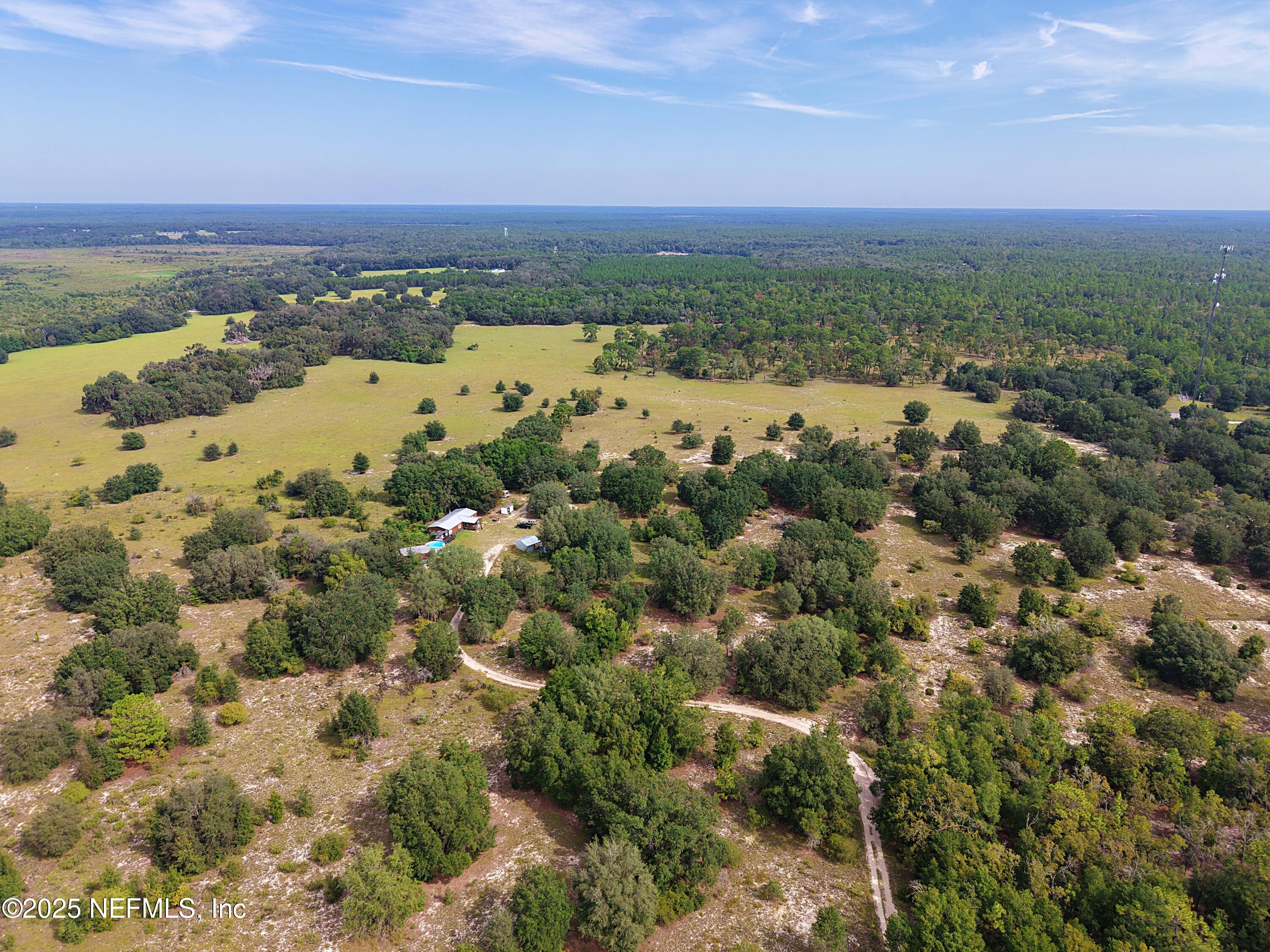347 Chesser Monroe Road Hawthorne, FL 32640 - Photo 14 of 16 a view of a city with mountains in the background