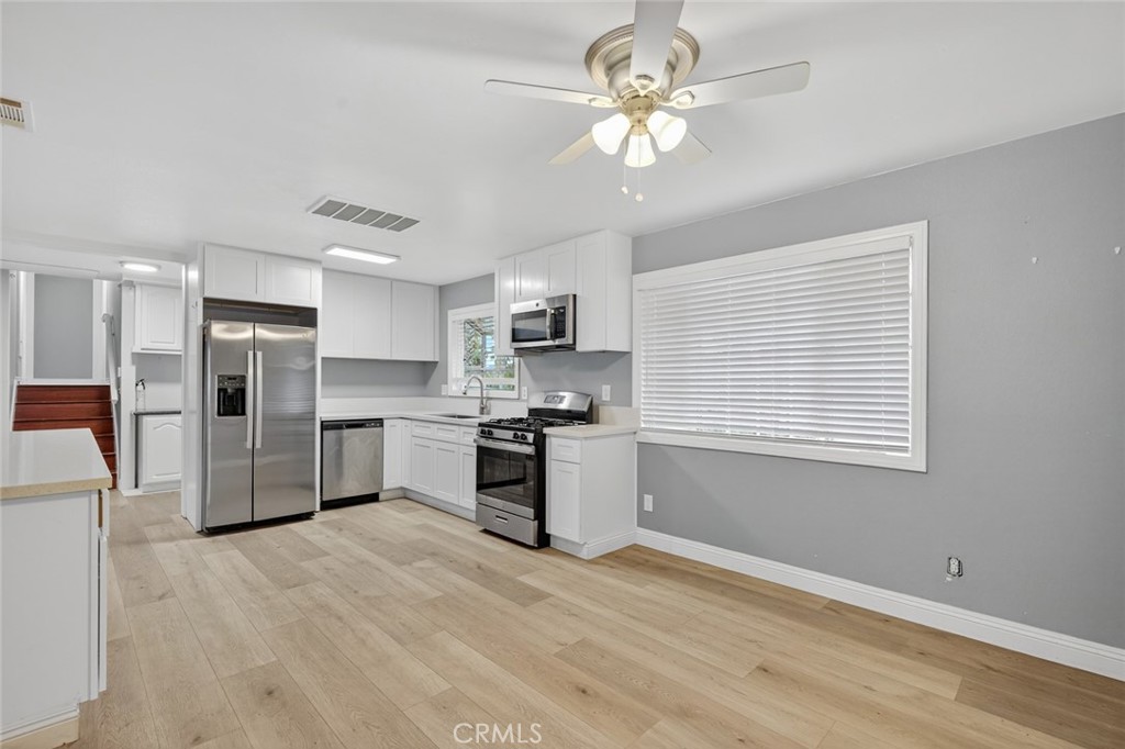 4060 Alto Street Oceanside, CA 92056 - Photo 11 of 56 a kitchen with stainless steel appliances a refrigerator sink and stove