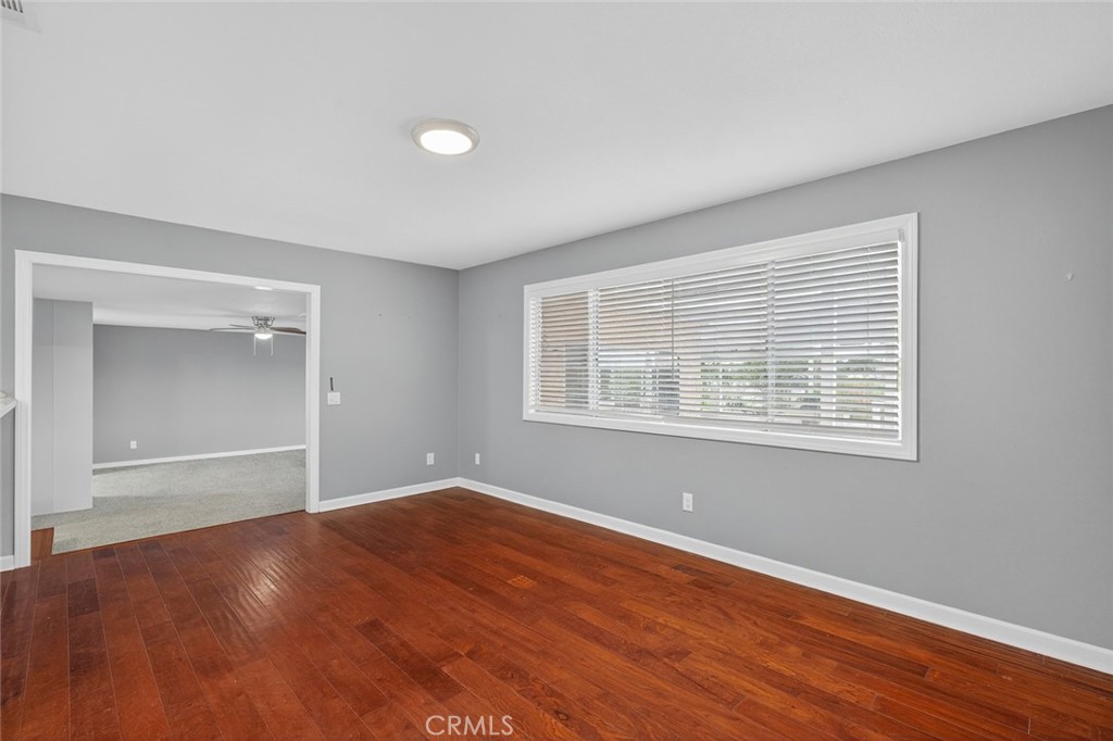 4060 Alto Street Oceanside, CA 92056 - Photo 13 of 56 a view of an empty room with wooden floor and a window