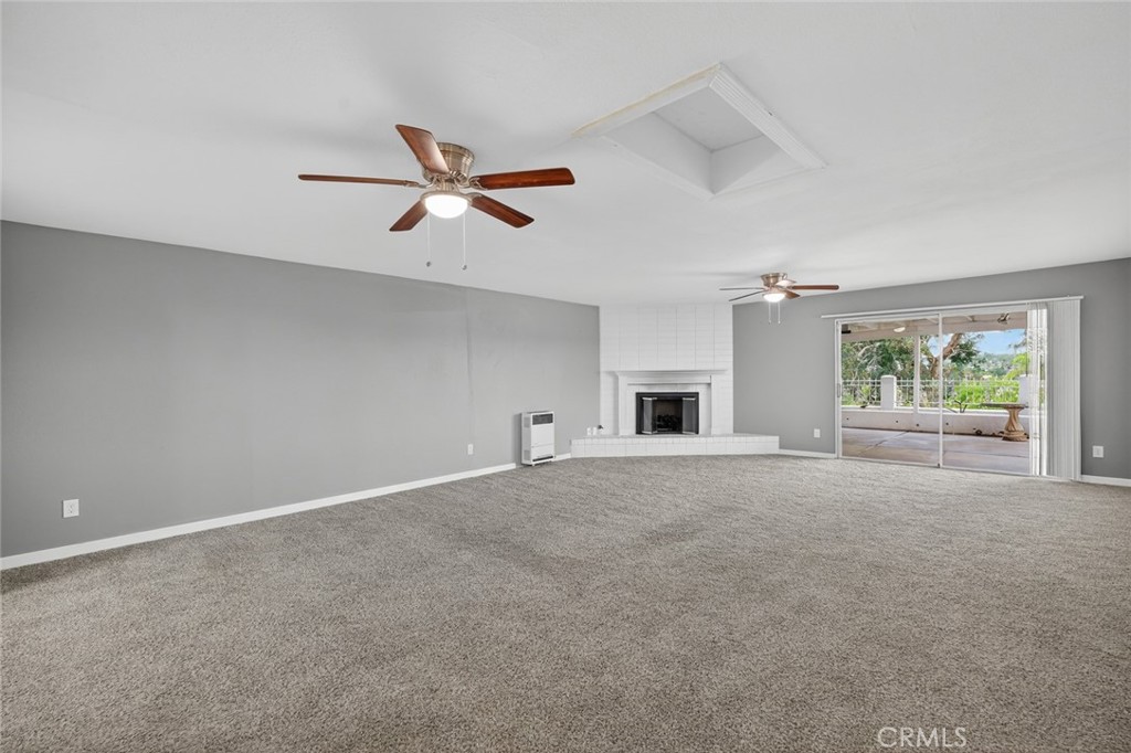4060 Alto Street Oceanside, CA 92056 - Photo 17 of 56 a view of a livingroom with a ceiling fan and window