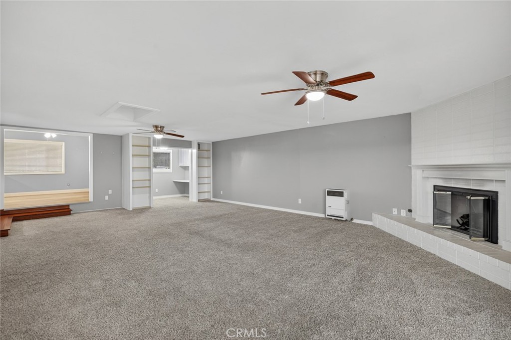 4060 Alto Street Oceanside, CA 92056 - Photo 20 of 56 wooden floor fireplace and windows in a room