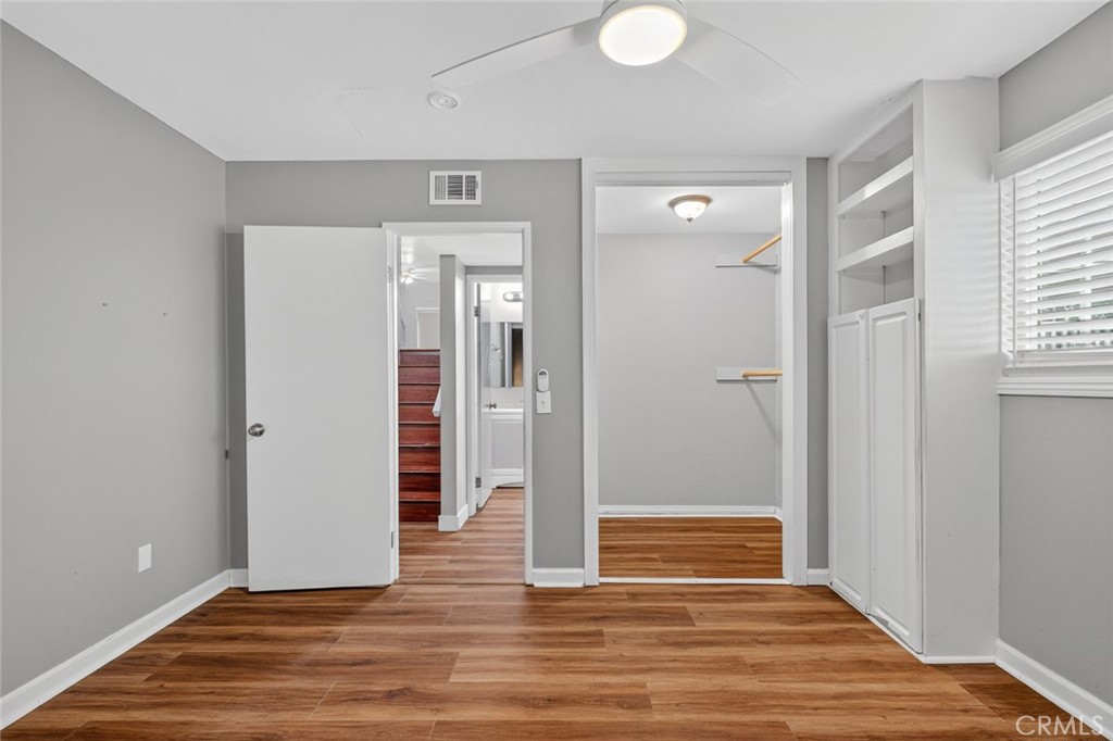 4060 Alto Street Oceanside, CA 92056 - Photo 24 of 56 a view of a hallway with wooden floor and closet area