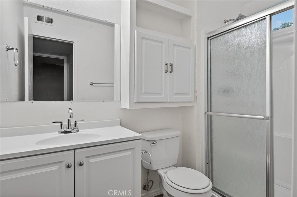 4060 Alto Street Oceanside, CA 92056 - Photo 26 of 56 a bathroom with a sink toilet and vanity