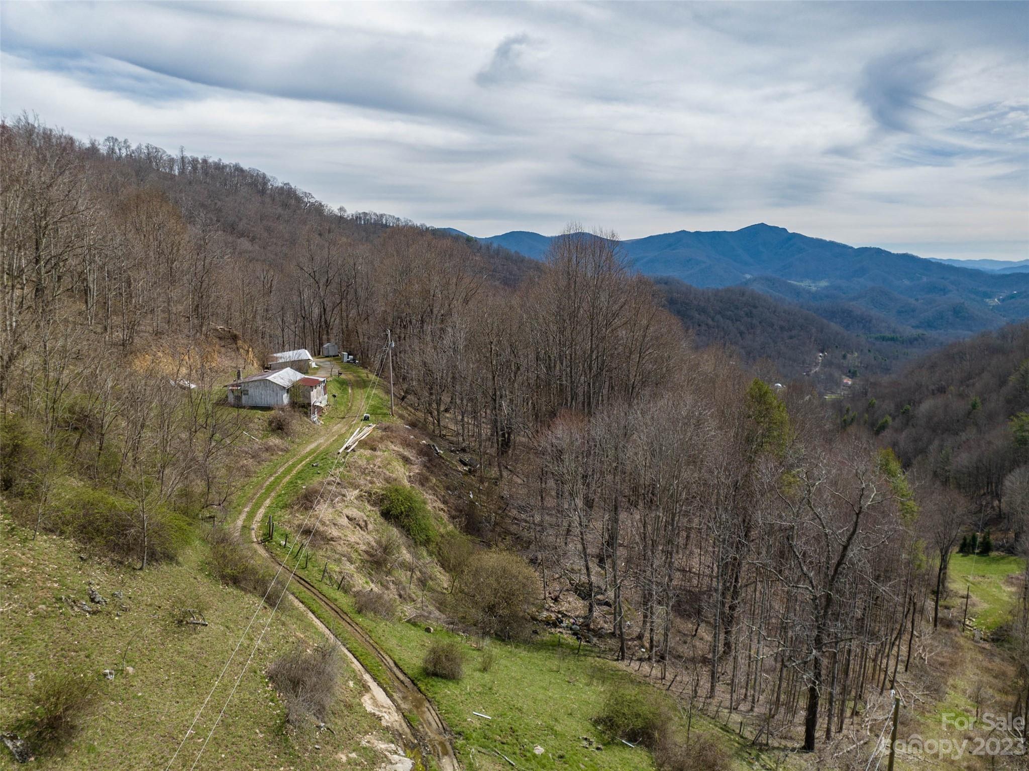 0 Wesley Creek Road Clyde, NC 28721 - Photo 24 of 45 a view of a city with mountains in the background