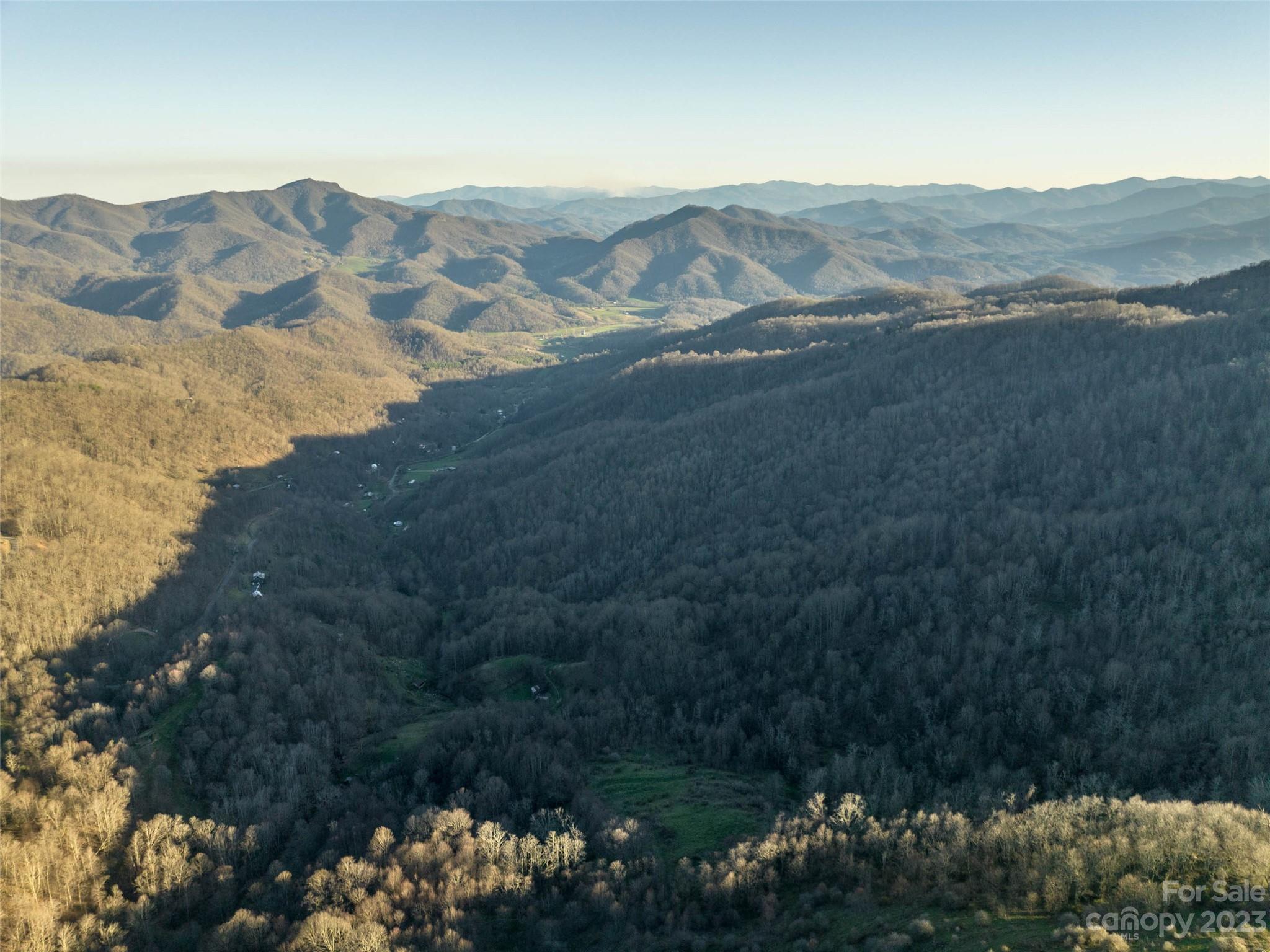 0 Wesley Creek Road Clyde, NC 28721 - Photo 43 of 45 a view of a town with mountains in the background