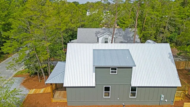 an aerial view of a house with a yard