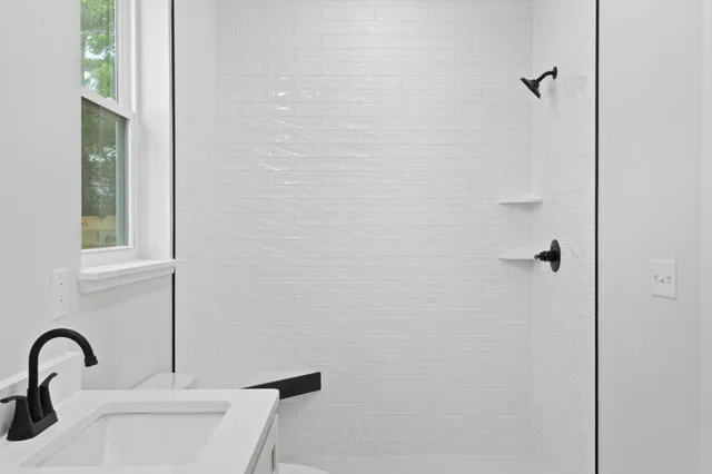 a bathroom with a sink and mirror