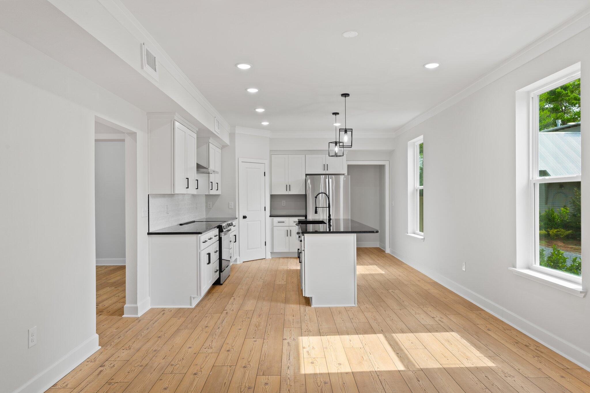 45 Laurel Oak Lane Santa Rosa Beach, FL 32459 - Photo 5 of 30 a kitchen with stainless steel appliances a refrigerator sink and stove