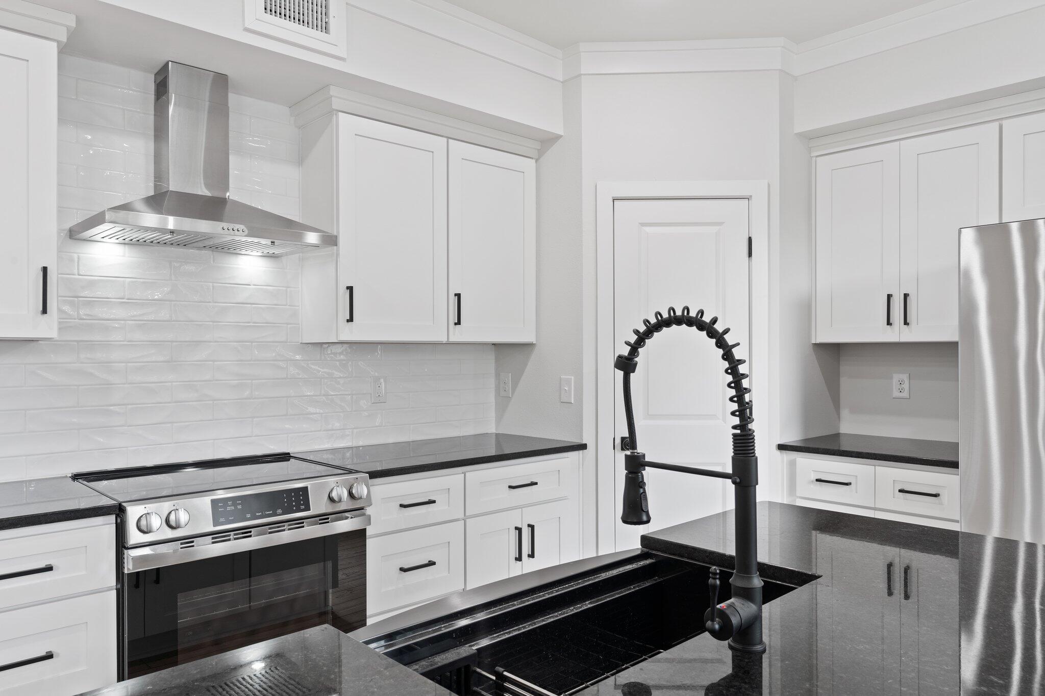 45 Laurel Oak Lane Santa Rosa Beach, FL 32459 - Photo 6 of 30 a kitchen with stainless steel appliances a stove and a refrigerator