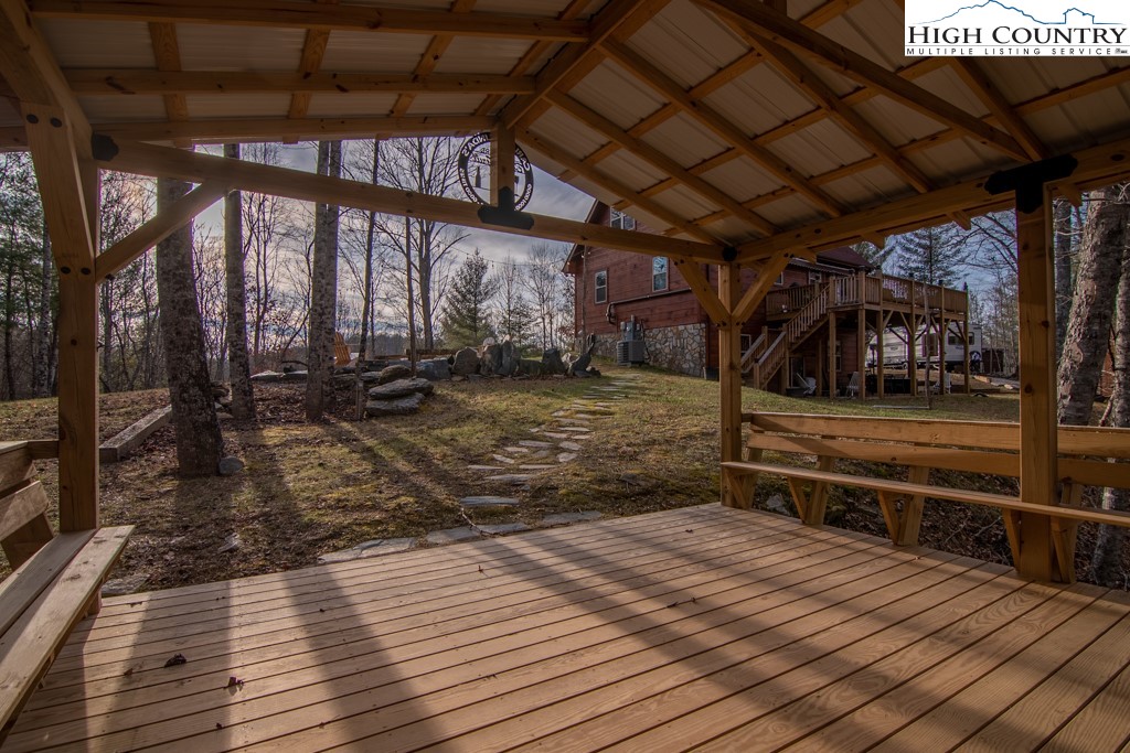 232 Bertie Circle Piney Creek, NC 28663 - Photo 11 of 50 a view of a porch with wooden floor