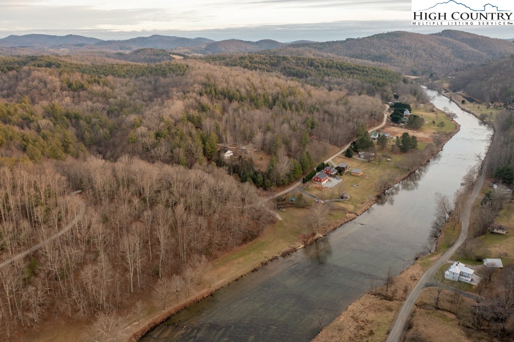 232 Bertie Circle Piney Creek, NC 28663 - Photo 15 of 50 a view of a town with mountains in the background