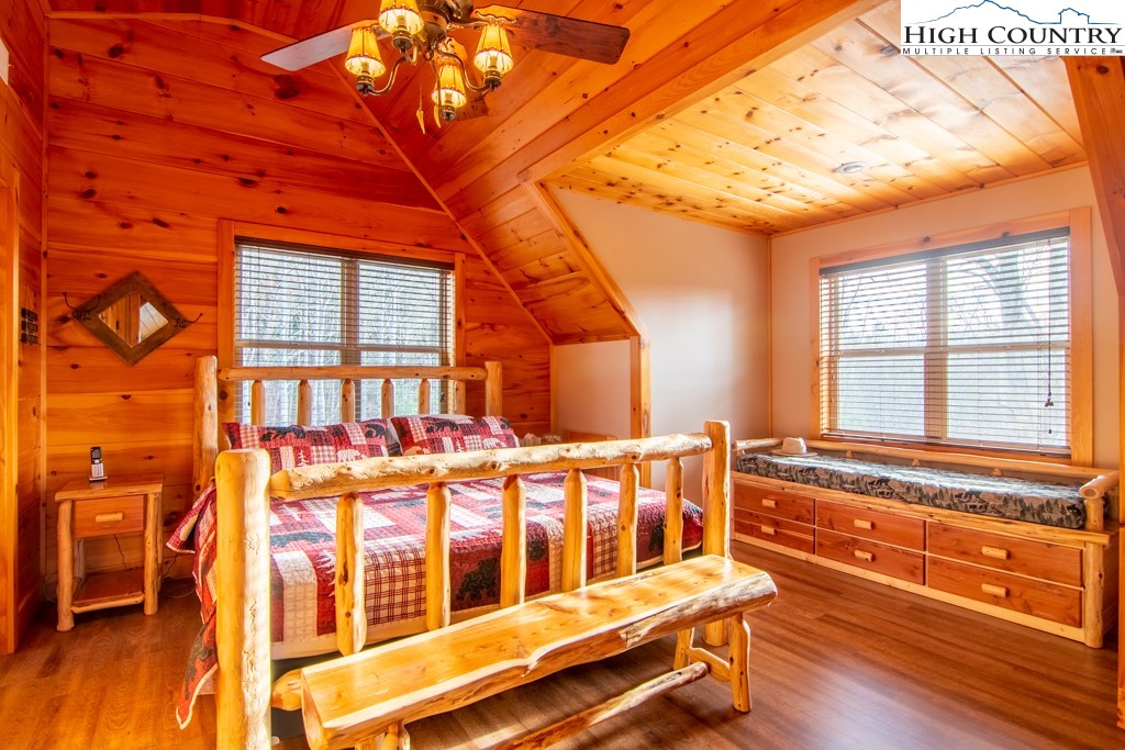 232 Bertie Circle Piney Creek, NC 28663 - Photo 16 of 50 a view of a large building with a bench