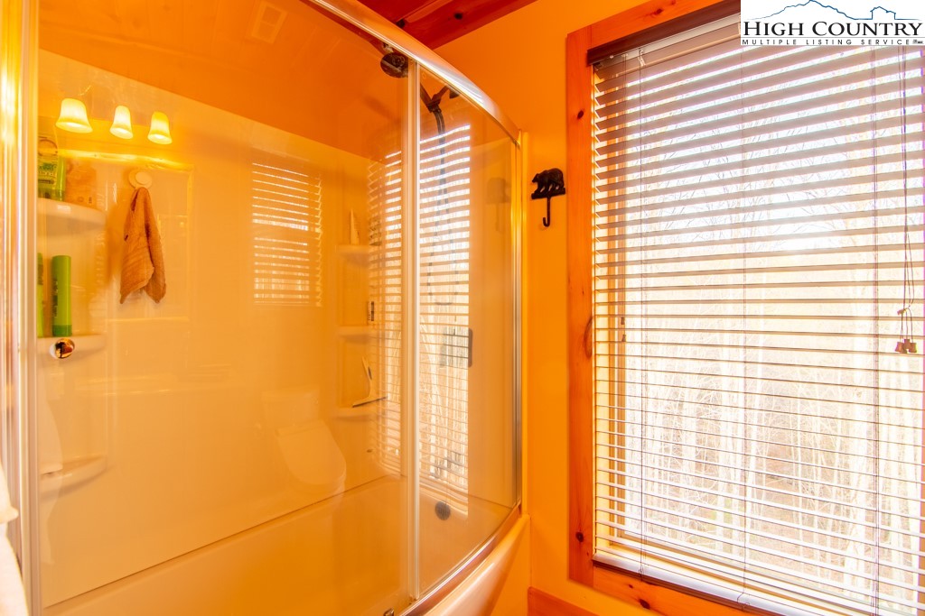 232 Bertie Circle Piney Creek, NC 28663 - Photo 21 of 50 a view of a bathroom with a shower