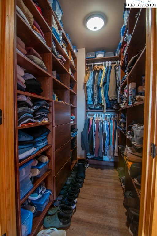 232 Bertie Circle Piney Creek, NC 28663 - Photo 22 of 50 a view of walk in closet with clothes and shoes