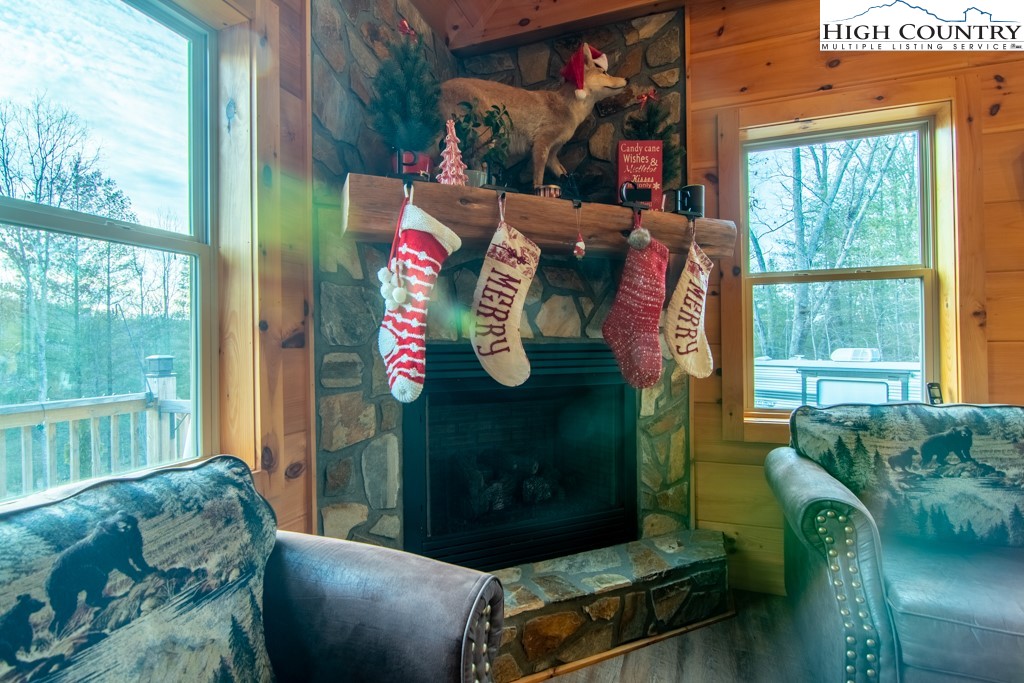 232 Bertie Circle Piney Creek, NC 28663 - Photo 30 of 50 a living room with furniture and a window