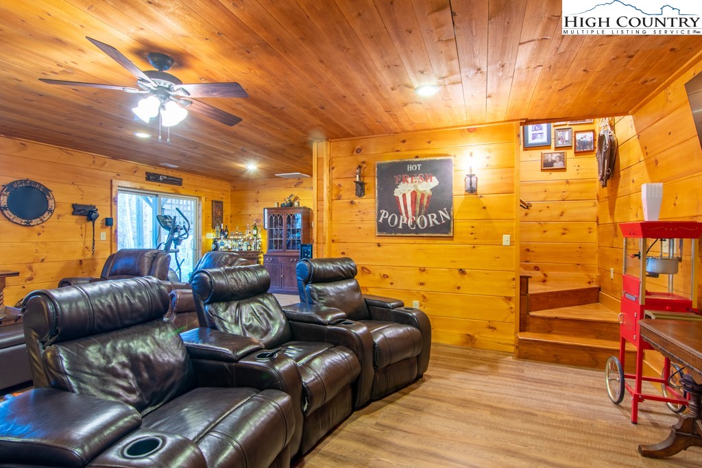 232 Bertie Circle Piney Creek, NC 28663 - Photo 36 of 50 a living room with furniture and a flat screen tv