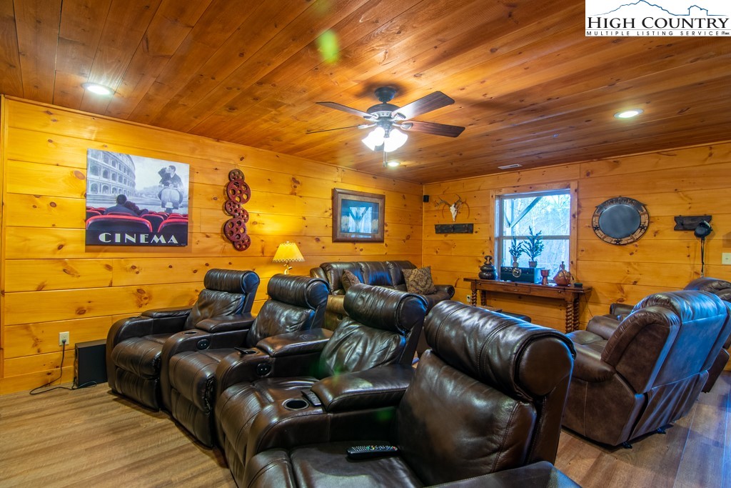 232 Bertie Circle Piney Creek, NC 28663 - Photo 37 of 50 a projector room with furniture and a flat screen tv