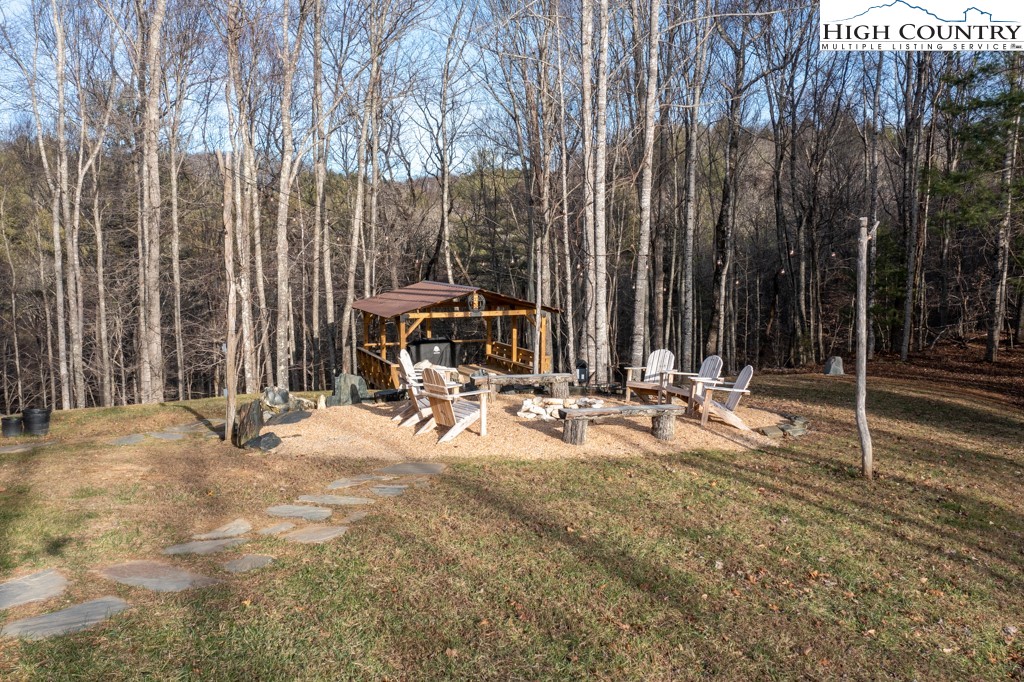 232 Bertie Circle Piney Creek, NC 28663 - Photo 6 of 50 a view of outdoor space with deck and trees