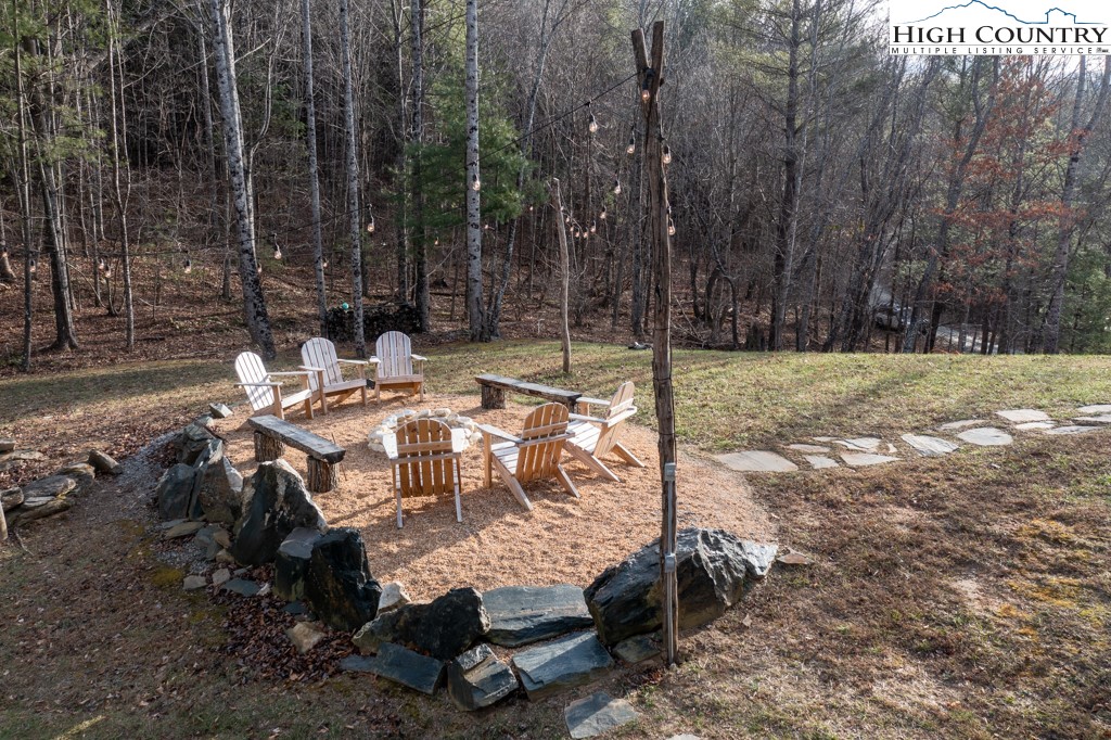 232 Bertie Circle Piney Creek, NC 28663 - Photo 7 of 50 a view of backyard with sitting area